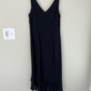 Knee length asymmetrical dress with beaded detail at bottom